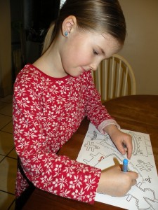 Emily Coloring her Paper Doll Outfits